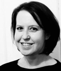 Black-and-white headshot of Jennifer Fry Devault smiling, chin-length dark hair